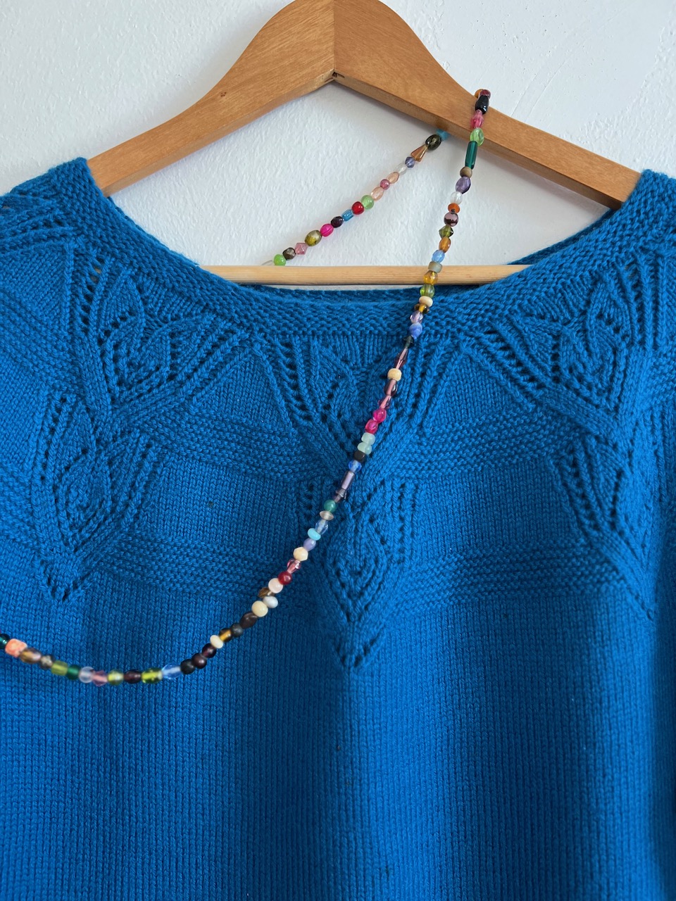 Blue sweater with beads